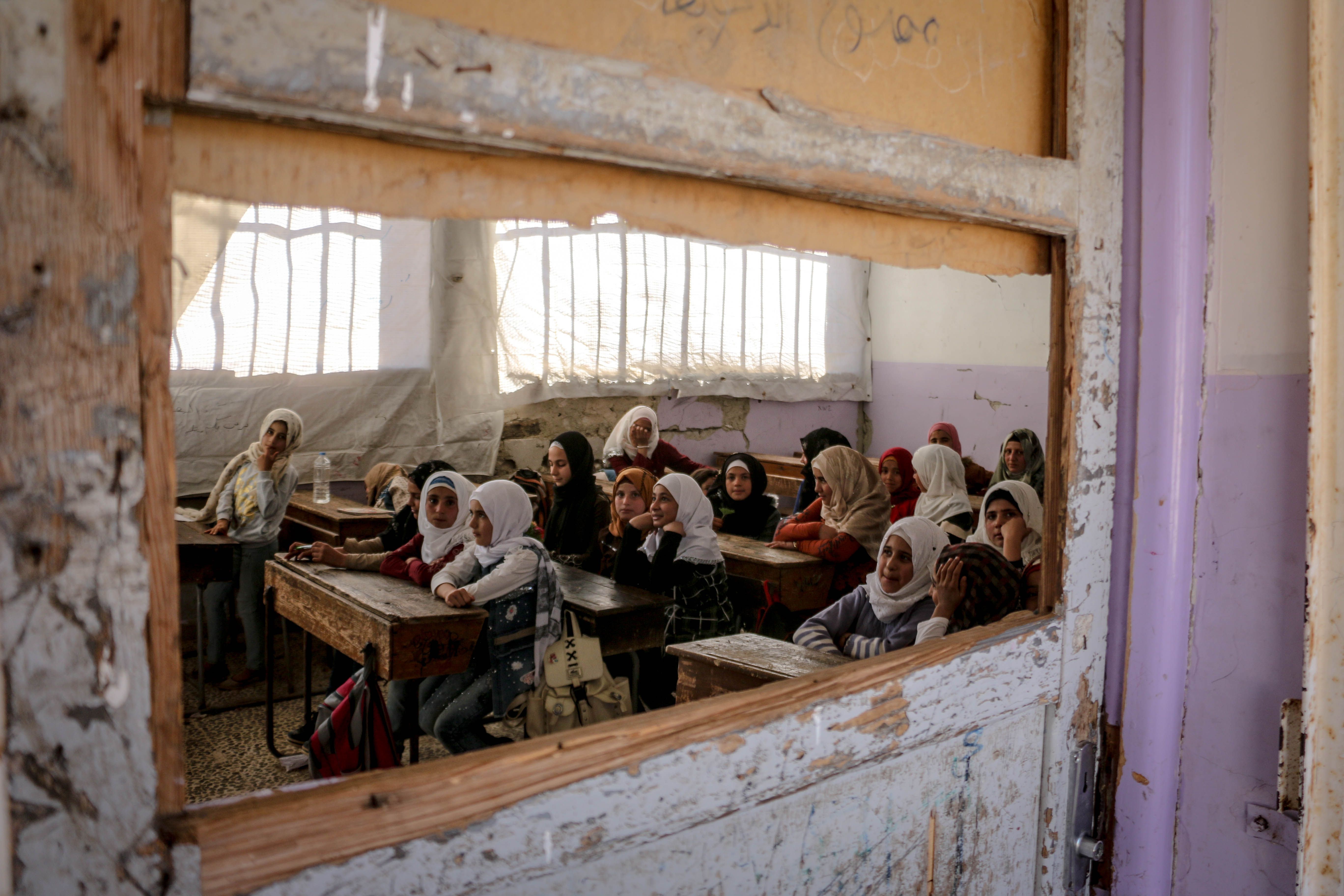 Schoolgirls seated together in a classroom