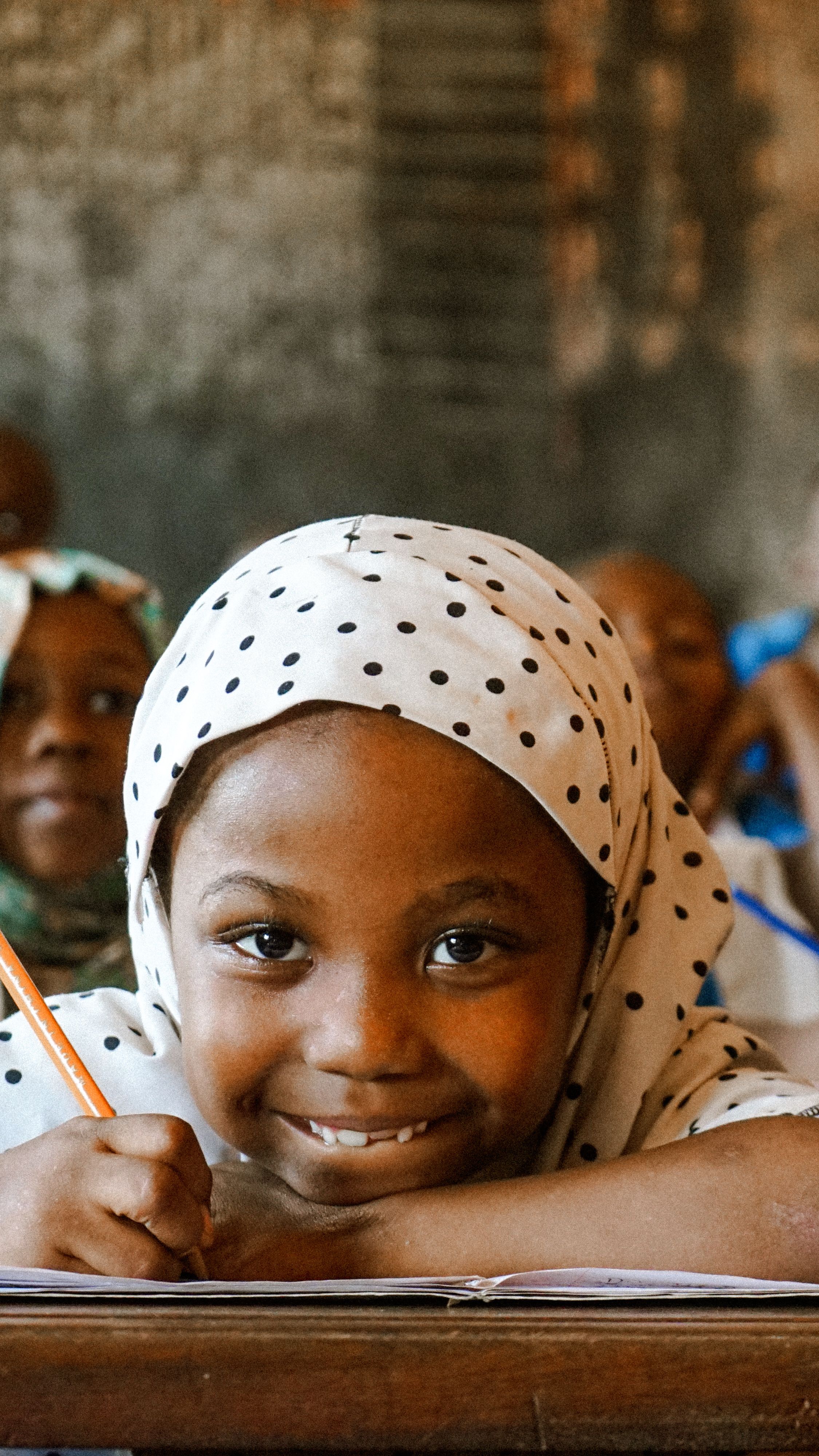 A young student writing in her notebook
